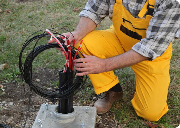 man fixing fiber cables